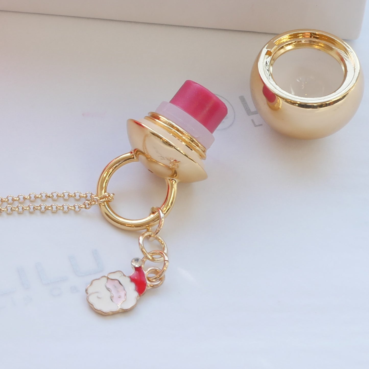 COSETTE GOLD W/ SANTA CHARM REFILLABLE LIP BALM NECKLACE  | LiLu Lip Care